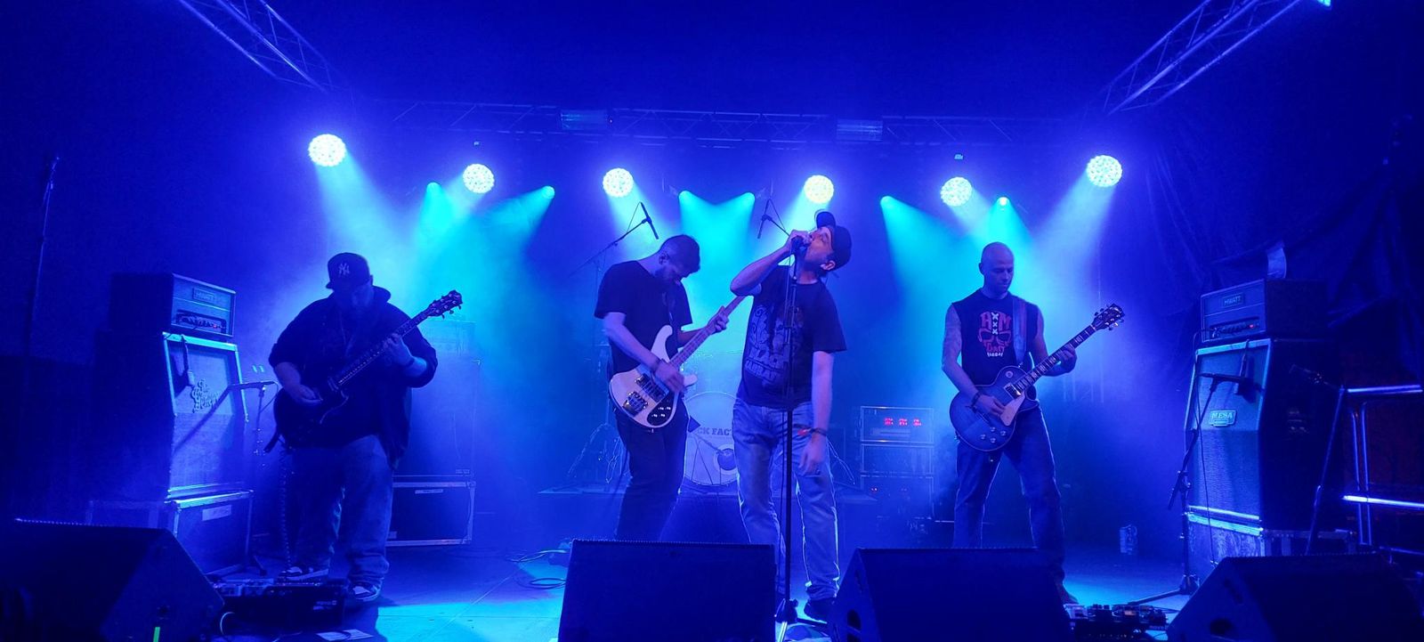 Godless Descent live in blue stage light